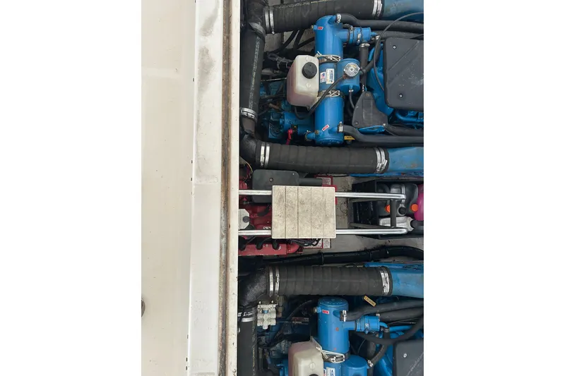 Slide: The Image of Engine compartment of a 2002 Tiara Yachts 3500 Open, showcasing dual engines and components. - 41