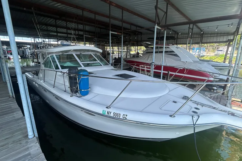 Slide: The Image of 2002 Tiara Yachts 3500 Open docked in a covered marina. - 14