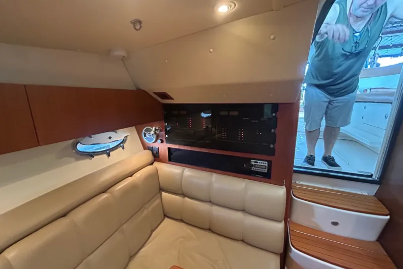 Slide: The Image of Interior of 2002 Tiara Yachts 3500 Open, featuring leather seating and control panel. - 34