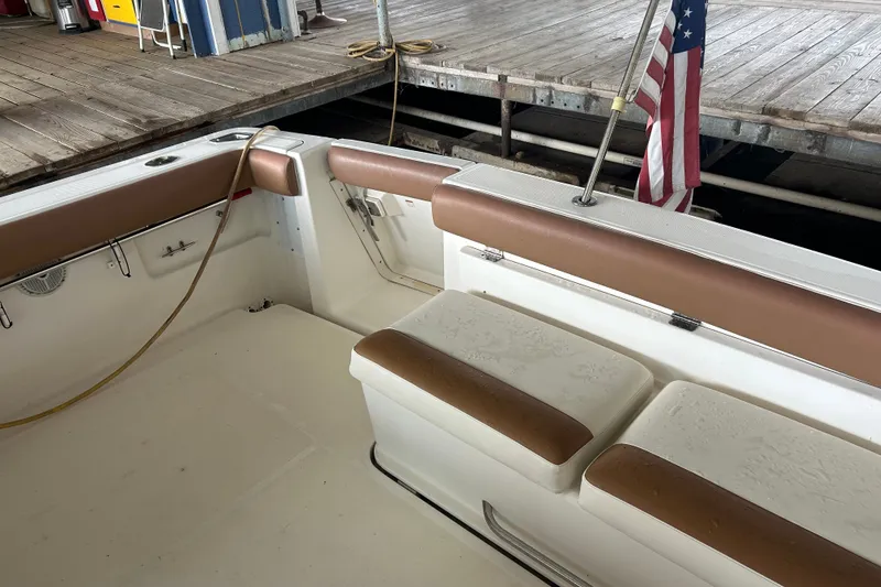 Slide: The Image of 2002 Tiara Yachts 3500 Open boat interior with seating and American flag. - 23