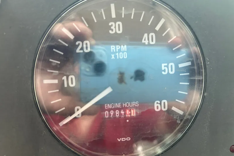 Slide: The Image of Close-up of Tiara Yachts 3500 Open 2002 tachometer showing 984 engine hours. - 35