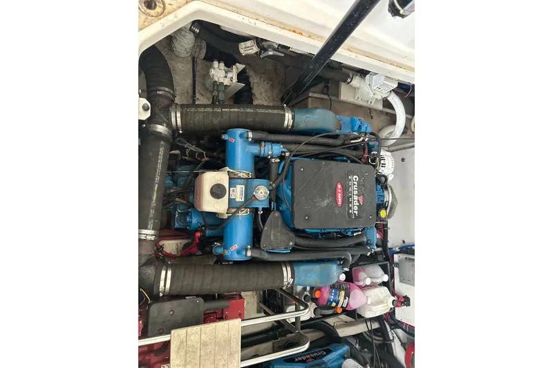 Slide: The Image of Engine compartment of a 2002 Tiara Yachts 3500 Open, featuring a Crusader engine. - 38