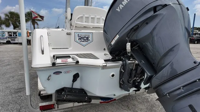 Slide: The Image of The image shows the stern of a Tidewater 232 CC Adventure boat with a Yamaha outboard motor. - 16
