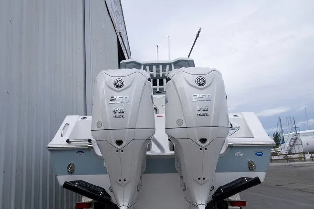 Slide: The Image of Two powerful outboard engines are mounted on the stern of a Tidewater 282 CC Adventure boat. - 29