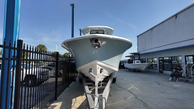 Slide: The Image of Tidewater 282 CC Adventure 2027 on a trailer in front of a building. - 28