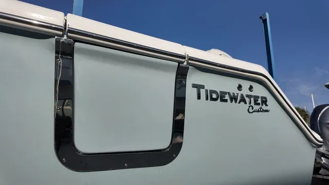 Slide: The Image of Close-up of the "Tidewater Custom" lettering on a boat hull. - 27