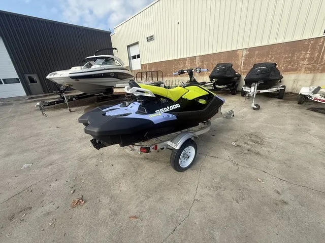 Slide: The Image of A 2024 Sea-Doo Spark Trixx for 3 is on a trailer outside a building. - 4