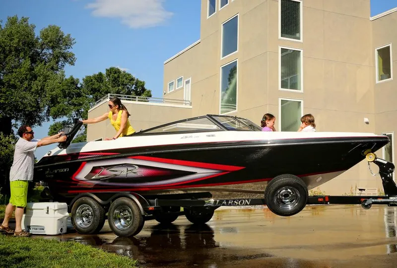 The Image of Manufacturer Provided Image: Family enjoying Larson LSR 2300 I/O boat on trailer, 2013 model. - 1