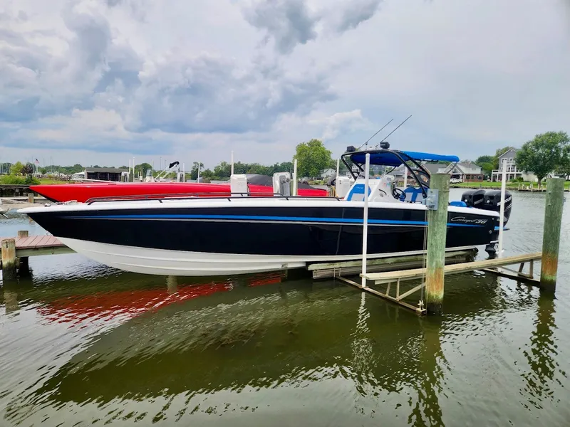 The Image of A blue and white boat docked. It's a 2015 Concept 36' CC. - 0