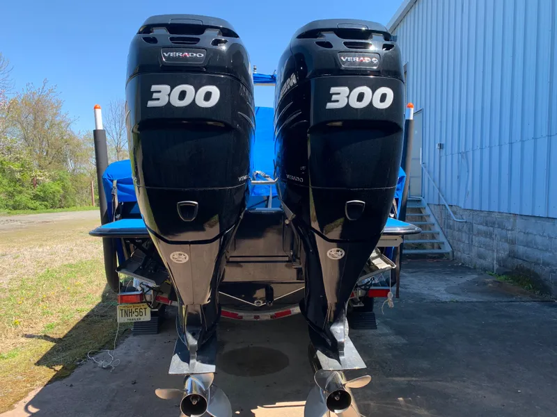 Slide: The Image of Two powerful outboard engines labeled "Verado 300" are mounted on the stern of a blue boat. - 23