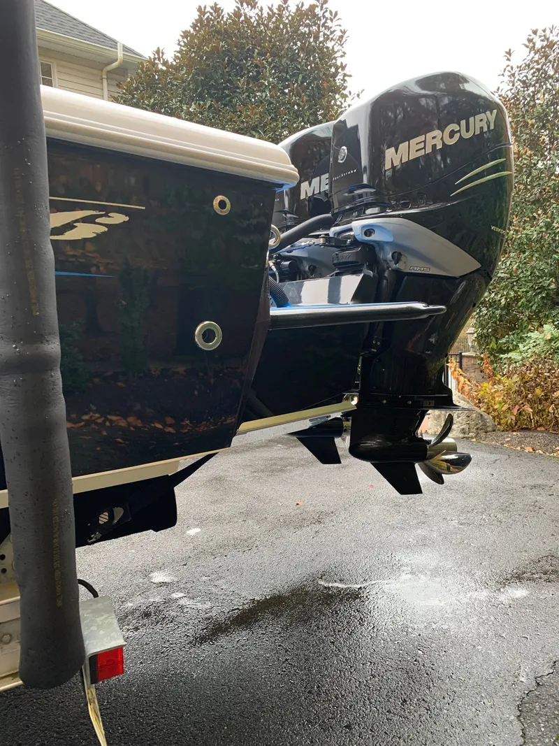 Slide: The Image of The image shows the stern of a boat with two Mercury outboard engines. - 21