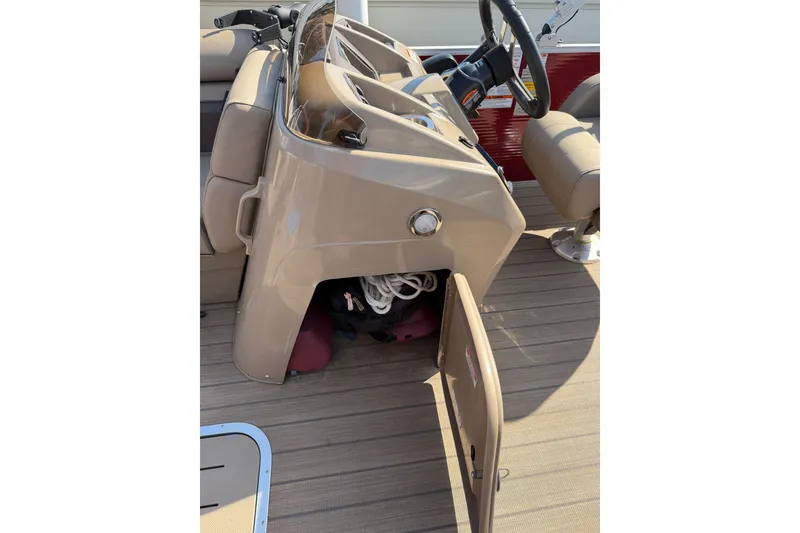 Slide: The Image of 2022 Bennington L 25 FISHING SSAPG boat console with open storage compartment. - 8