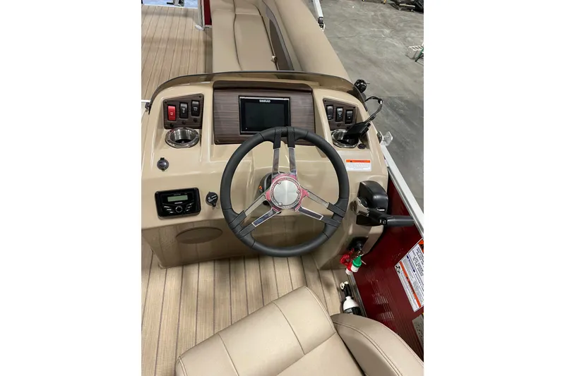 Slide: The Image of 2022 Bennington L 25 FISHING SSAPG boat dashboard with steering wheel and controls. - 4
