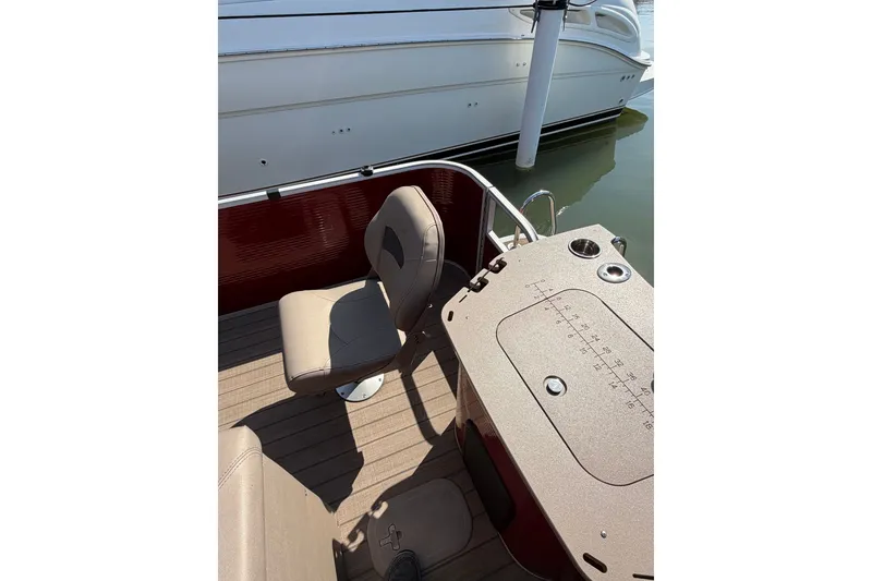 Slide: The Image of 2022 Bennington L 25 FISHING SSAPG boat interior with seating and fishing station. - 10