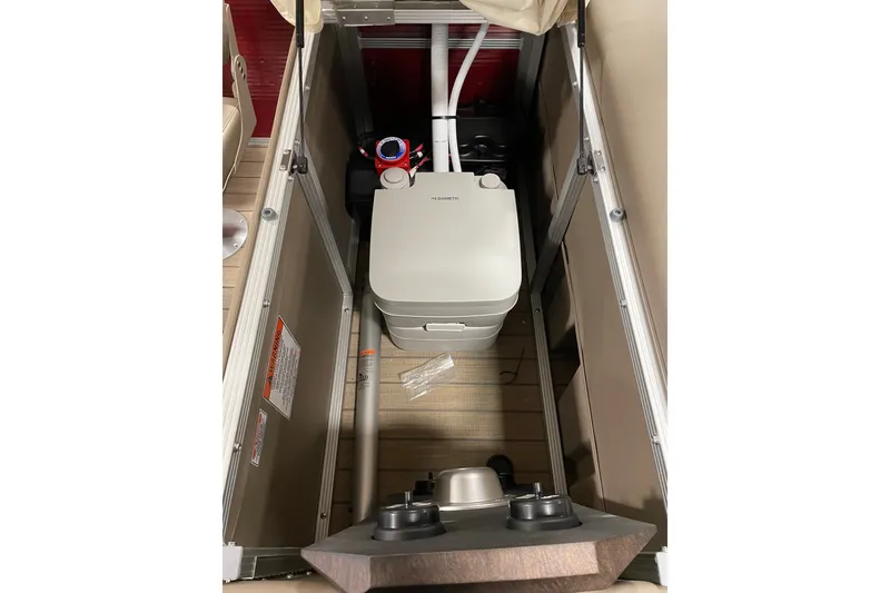 Slide: The Image of 2022 Bennington L 25 FISHING SSAPG boat storage compartment with portable toilet. - 26