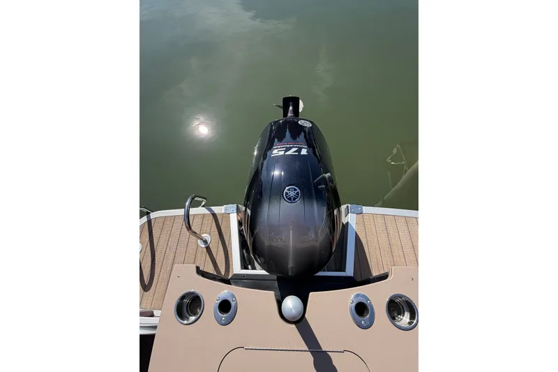 Slide: The Image of 2022 Bennington L 25 FISHING SSAPG boat with Yamaha outboard motor on calm water. - 20