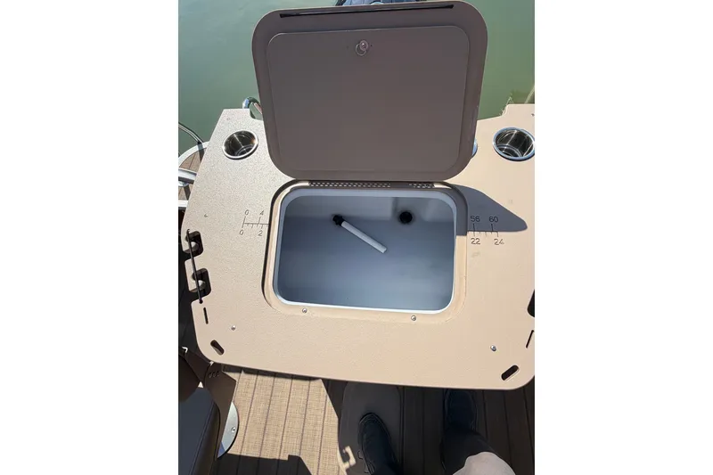 Slide: The Image of Open storage compartment on 2022 Bennington L 25 FISHING SSAPG boat. - 11