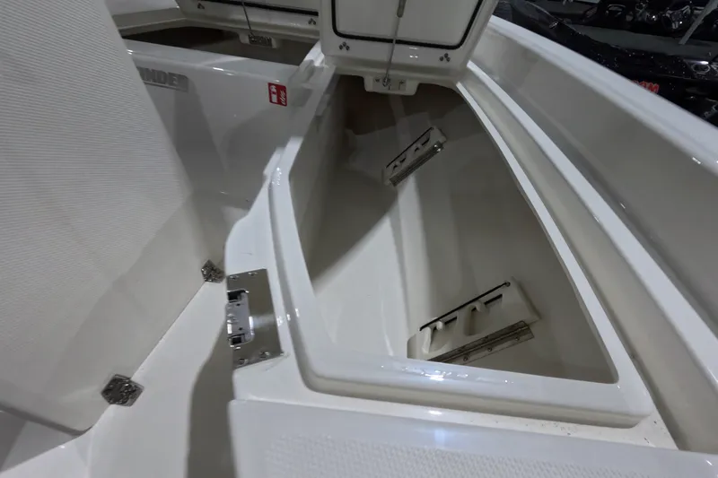 Slide: The Image of Open storage compartment in 2027 Pathfinder 2200 Hybrid boat. - 19