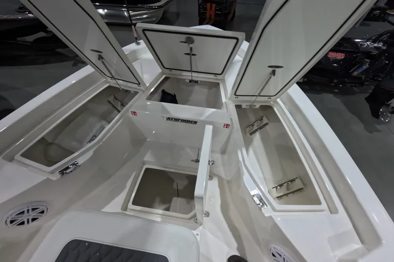 Slide: The Image of 2027 Pathfinder 2200 Hybrid boat interior with open storage compartments. - 18