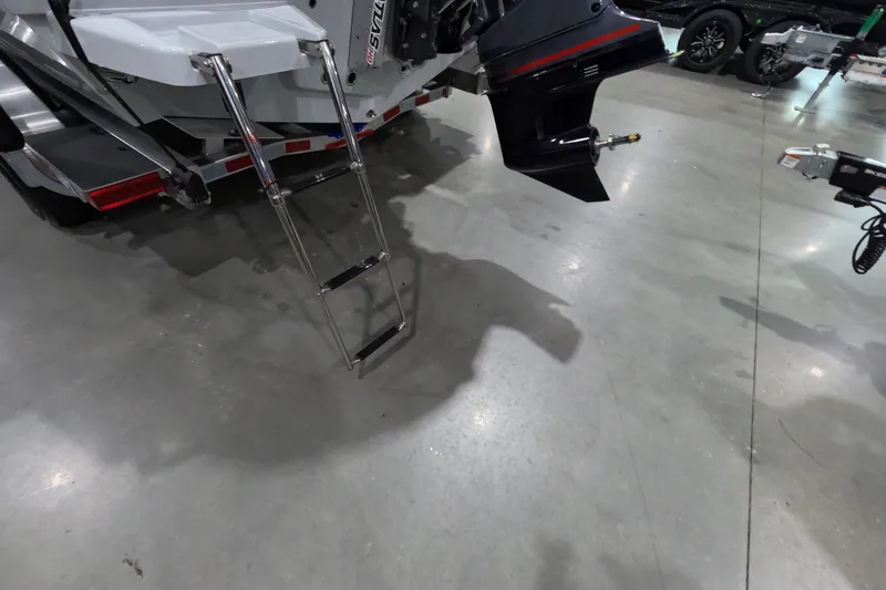 Slide: The Image of Rear view of 2027 Pathfinder 2200 Hybrid boat with ladder and motor on display. - 22