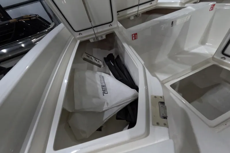 Slide: The Image of Open storage compartments in a 2027 Pathfinder 2200 Hybrid boat. - 20