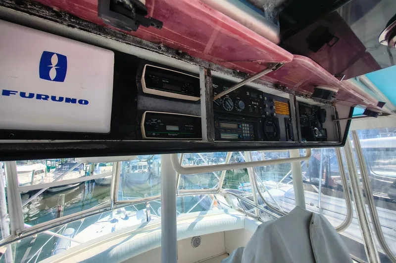 Slide: The Image of Control panel of a 1985 Bertram 42 Convertible boat with Furuno equipment. - 11