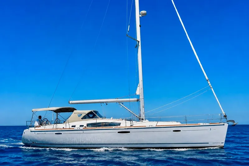 The Image of 2008 Beneteau 49 sailboat cruising on open sea under clear blue sky. - 1