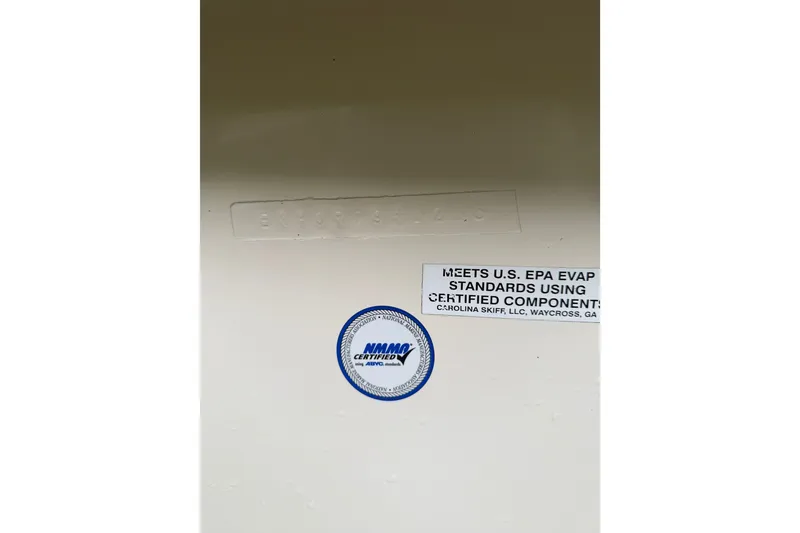 Slide: The Image of 2013 Carolina Skiff 178 DLV compliance label, EPA standards, NMMA certified. - 18
