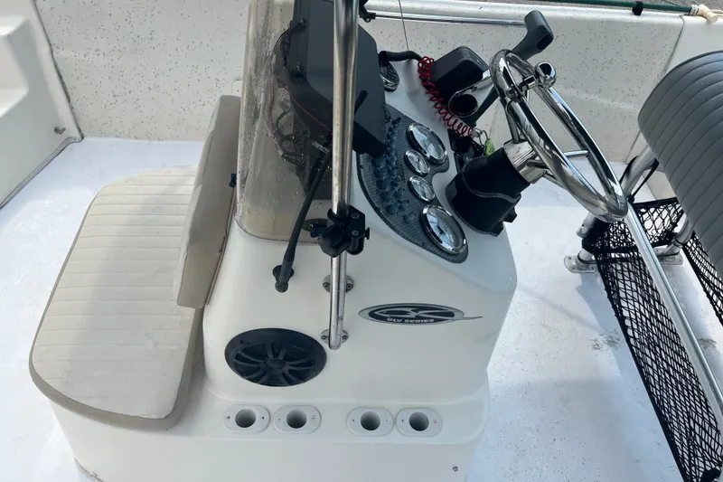 Slide: The Image of 2013 Carolina Skiff 178 DLV boat console with steering wheel and gauges. - 14