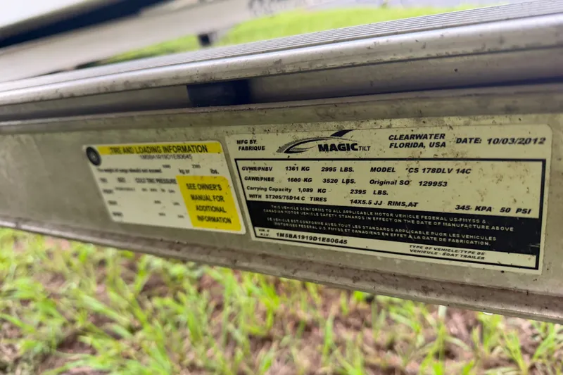 Slide: The Image of Label on a 2013 Carolina Skiff 178 DLV trailer, detailing tire and loading information. - 20