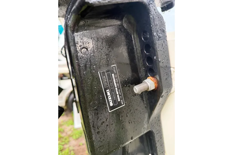 Slide: The Image of Close-up of a Suzuki DF90A engine part on a 2013 Carolina Skiff 178 DLV boat. - 19