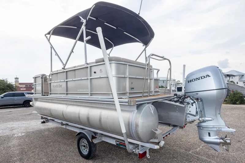 Slide: The Image of 2016 South Bay 5220CR pontoon boat with Honda outboard motor on trailer. - 14