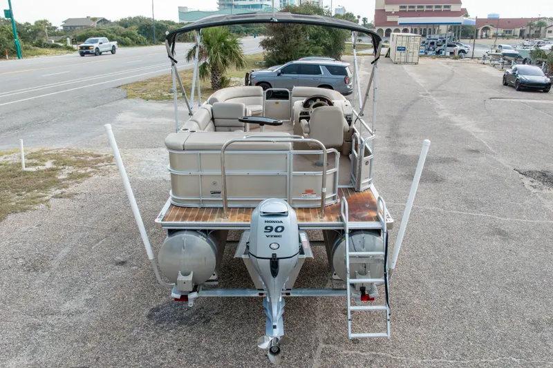 Slide: The Image of 2016 South Bay 5220CR pontoon boat with Honda 90 VTEC engine, parked near a road. - 41