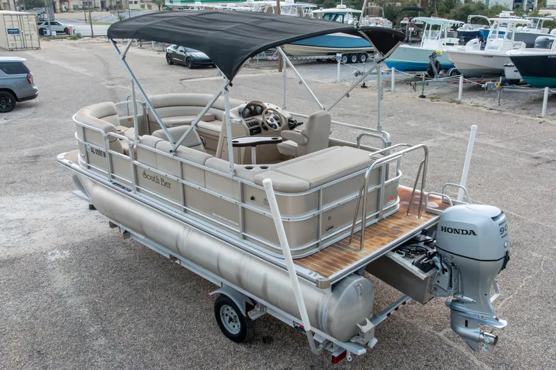 Slide: The Image of 2016 South Bay 5220CR pontoon boat with Honda outboard motor and canopy. - 40