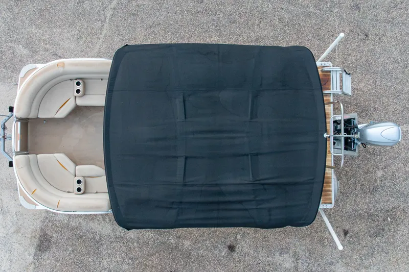 Slide: The Image of Overhead view of a 2016 South Bay 5220CR pontoon boat with black canopy. - 6