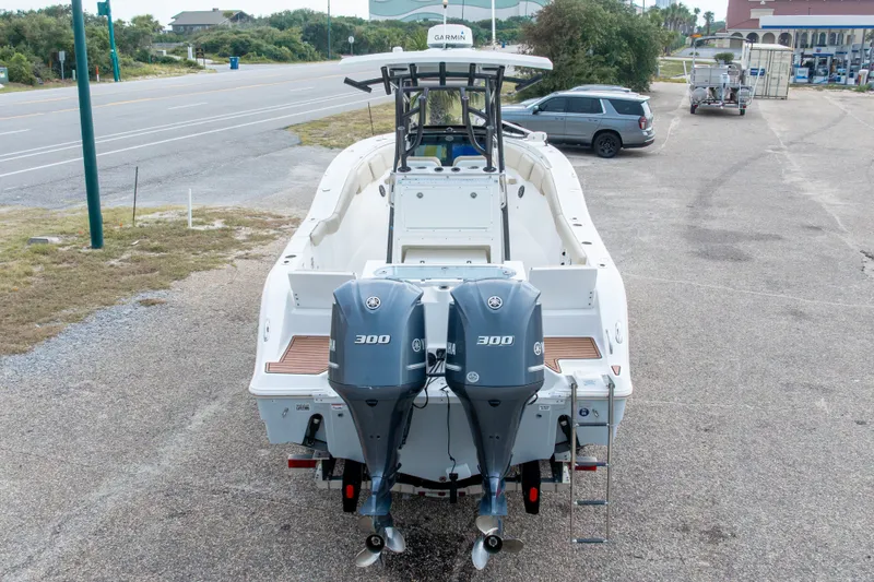 Slide: The Image of 2016 Sea Fox 288 Commander boat with dual Yamaha 300 engines, parked on a roadside. - 63