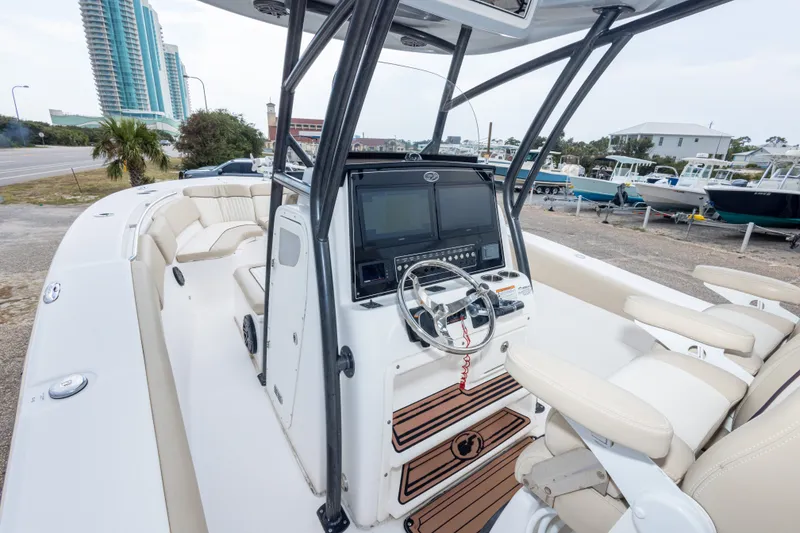 Slide: The Image of 2016 Sea Fox 288 Commander boat interior with helm, seating, and modern controls. - 24
