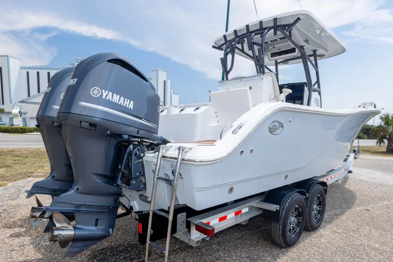 Slide: The Image of 2016 Sea Fox 288 Commander boat with dual Yamaha engines on a trailer. - 13