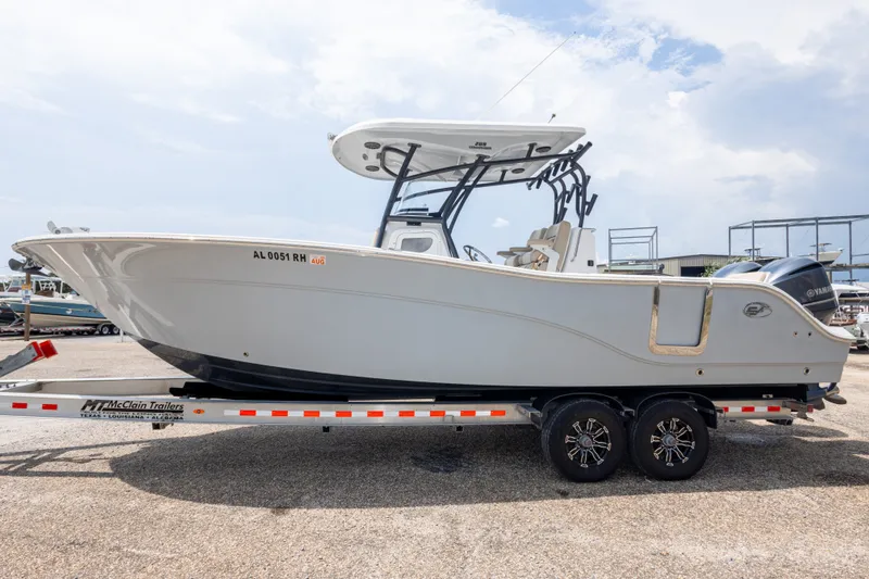 Slide: The Image of 2016 Sea Fox 288 Commander boat on trailer, side view, clear sky background. - 16