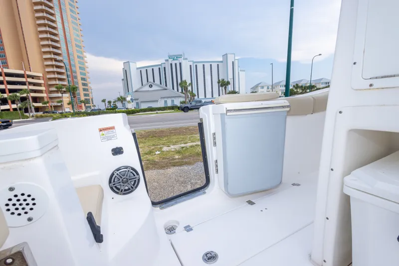 Slide: The Image of Interior view of a 2016 Sea Fox 288 Commander boat with open door and cityscape background. - 53
