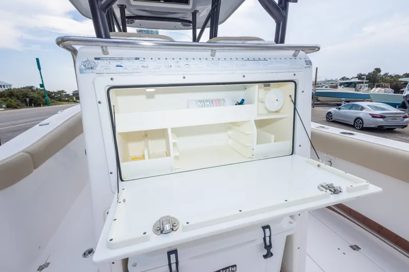 Slide: The Image of 2016 Sea Fox 288 Commander boat with open storage compartment on deck. - 51