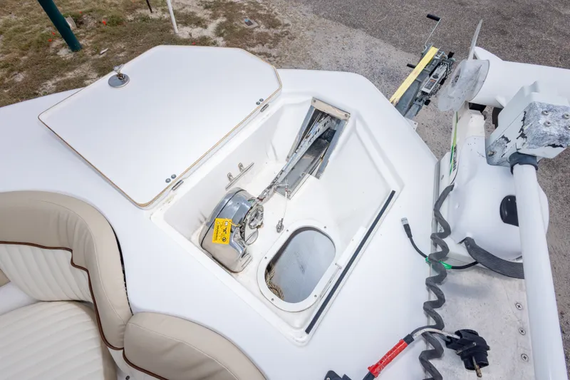Slide: The Image of Anchor compartment of a 2016 Sea Fox 288 Commander boat, featuring storage and winch. - 38