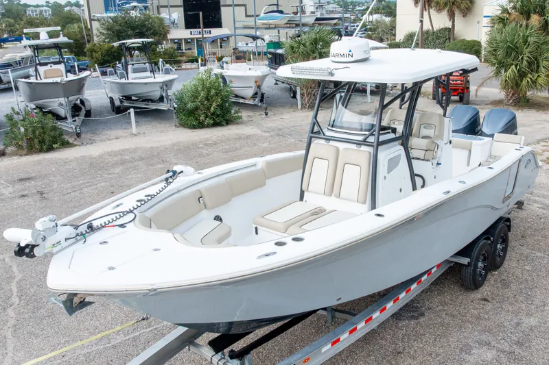 Slide: The Image of 2016 Sea Fox 288 Commander boat on trailer, parked at marina with other boats. - 4