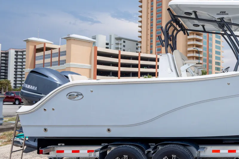 Slide: The Image of 2016 Sea Fox 288 Commander boat on trailer, city buildings in background. - 59