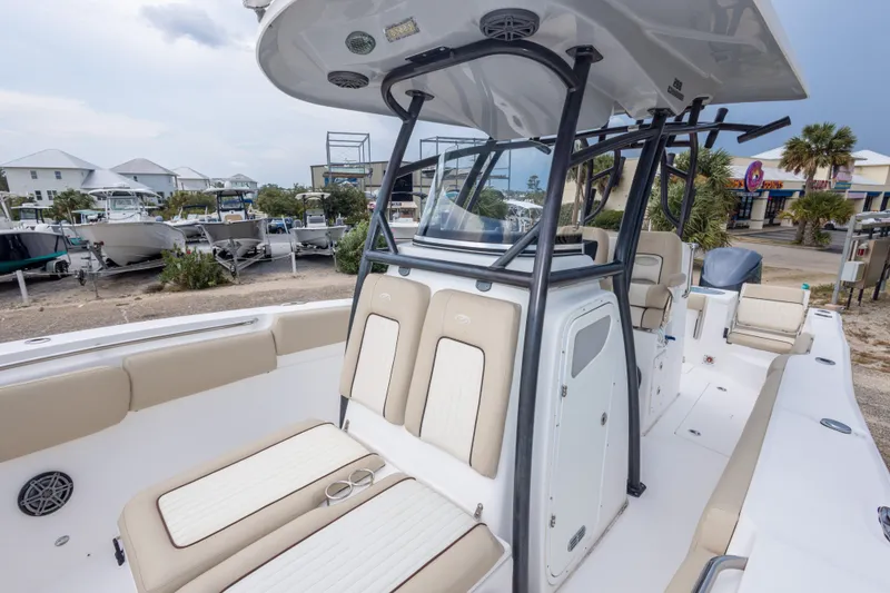 Slide: The Image of 2016 Sea Fox 288 Commander boat interior with seating and console, docked at marina. - 45