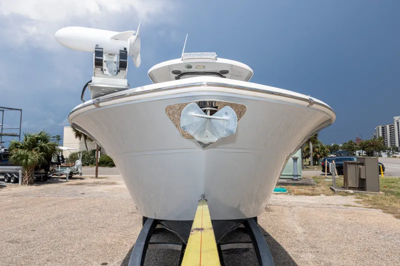 Slide: The Image of 2016 Sea Fox 288 Commander boat on trailer, front view, under cloudy sky. - 18