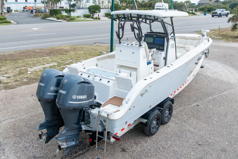Slide: The Image of 2016 Sea Fox 288 Commander boat with dual Yamaha engines on a trailer. - 62