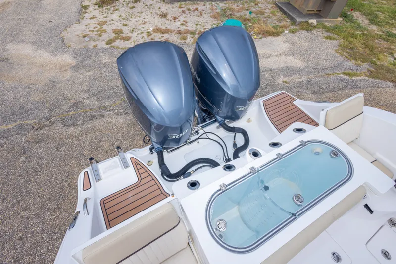 Slide: The Image of 2016 Sea Fox 288 Commander boat with twin outboard engines and spacious deck layout. - 55