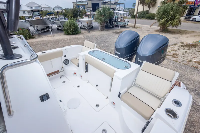 Slide: The Image of 2016 Sea Fox 288 Commander boat interior with twin engines and seating area. - 49
