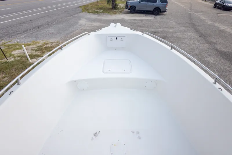Slide: The Image of Bow view of 2011 PROLINE 21 CC SE boat, showcasing spacious deck and storage hatch. - 28